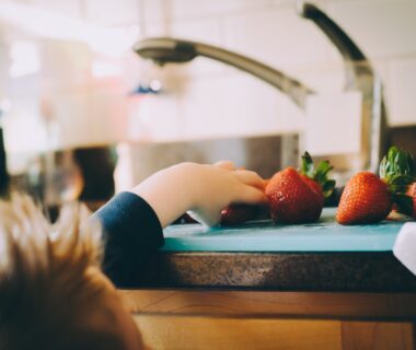 Is it okay to be selfish? toddler grabbing strawberries from plate